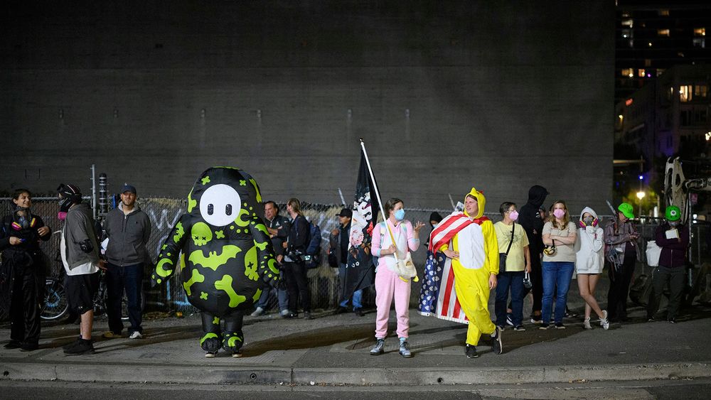 Images of Portland, Oregon anti-ICE demonstrators in colorful costumes.  From 2025-10-02 Atlantic article.