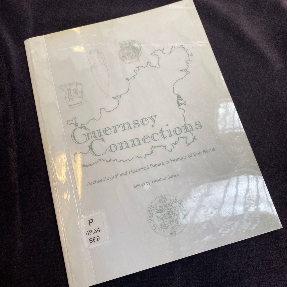 The book ‘Guernsey Connections’ laid on black cloth.