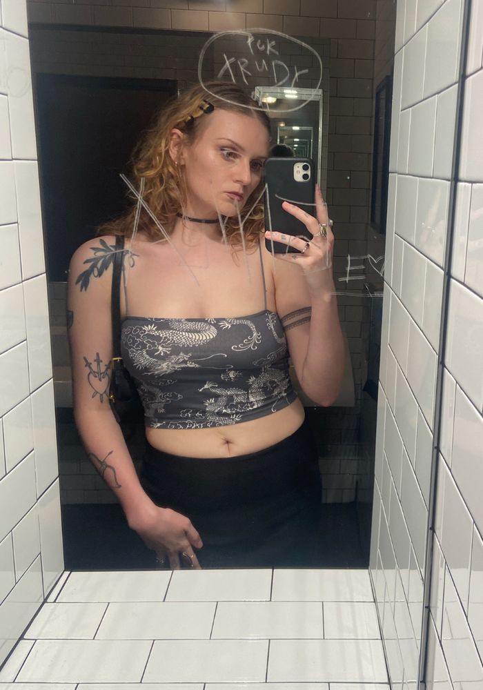 Me after I learned to become hot in the gloriously lit but heavily scratched bathroom mirror of Sleeping Village in August of 2025