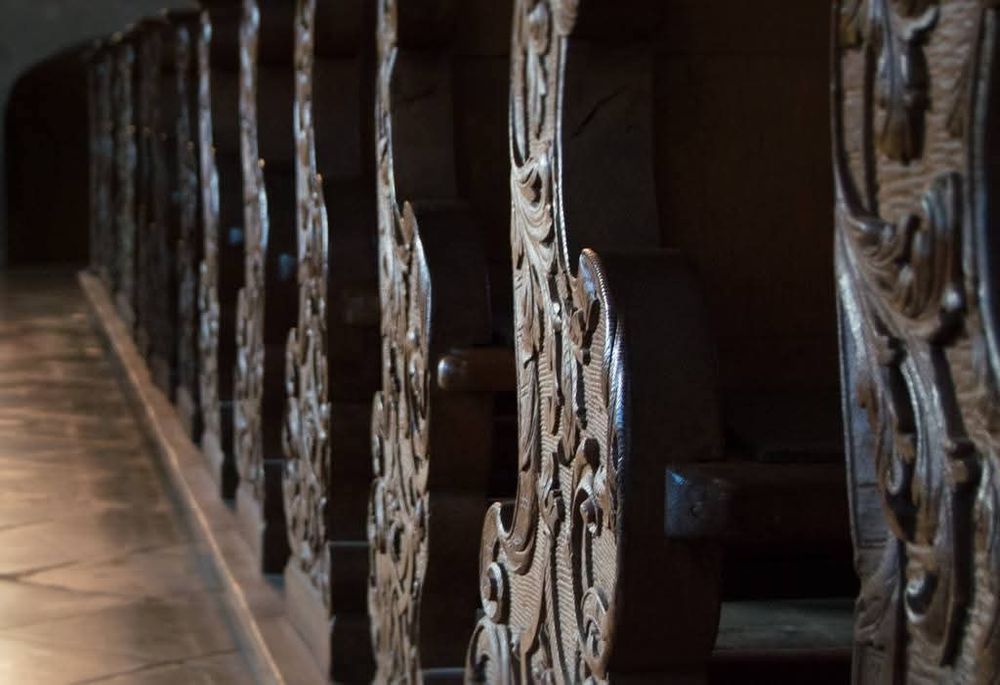 Intricate carvings on the wooden pews