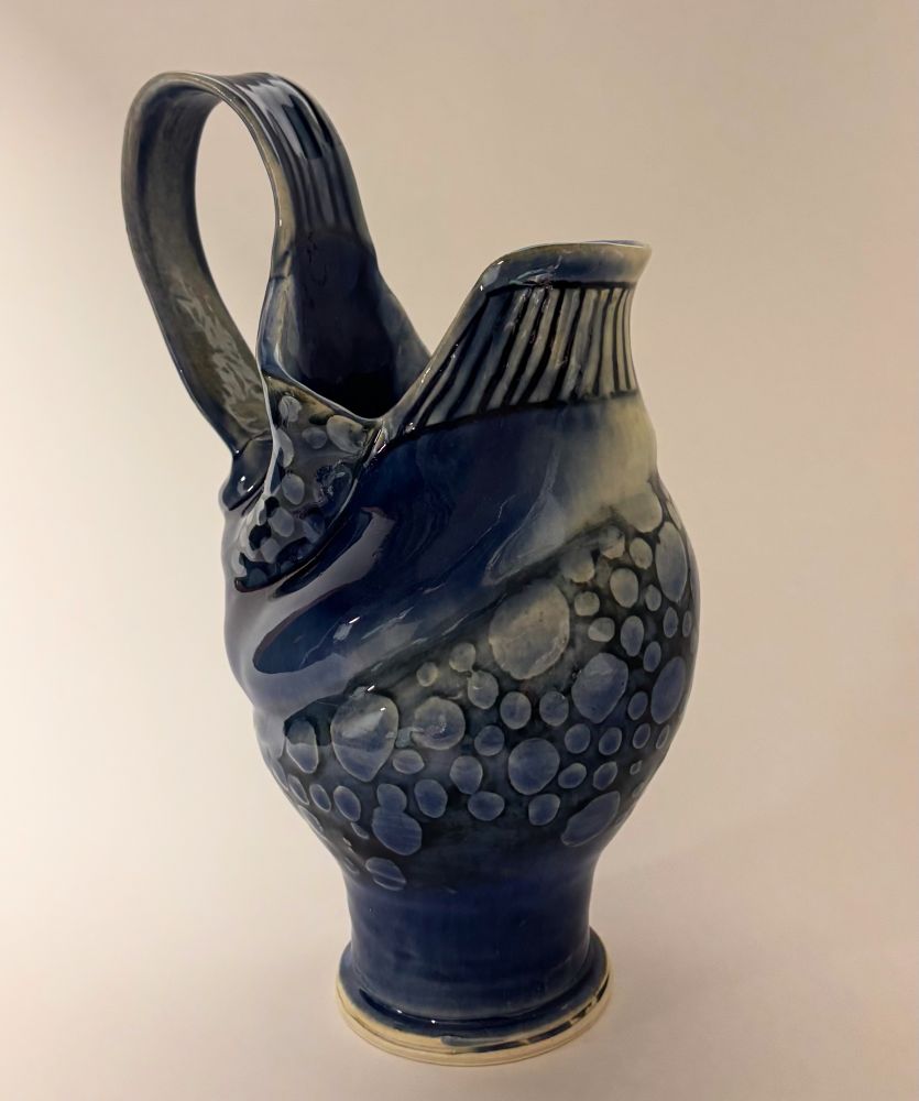 Pottery: Blue and white pitcher with bubble texture. 