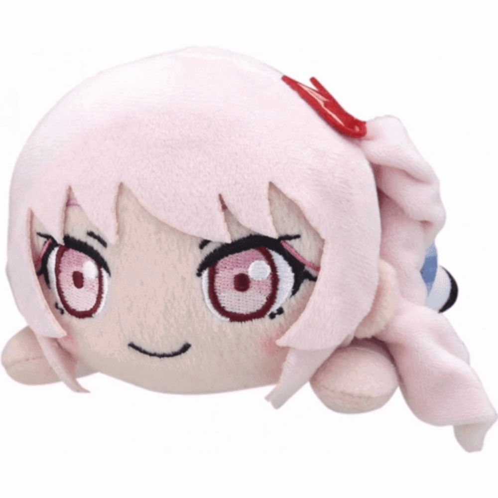 a stuffed animal with pink hair and red eyes laying down