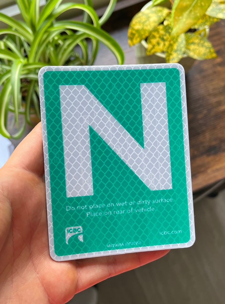 a photo of the green N "new driver" magnet that goes on the back of a car in BC