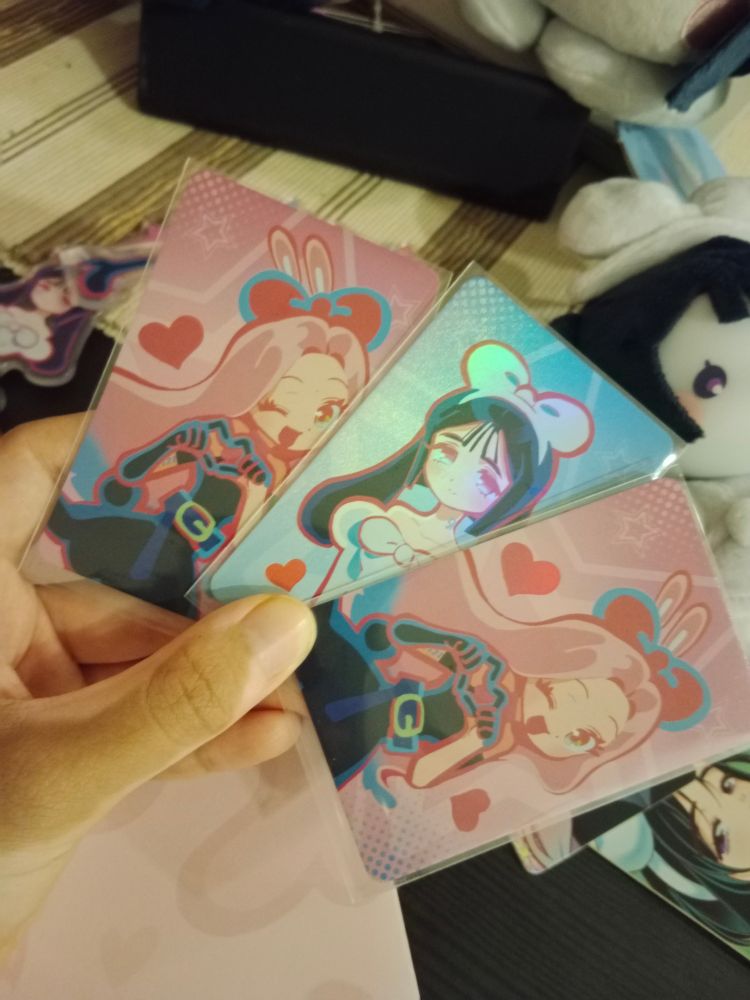 Me holding up the bunny mizi and sua photocard, except i got an extra mizi photocard by accident 