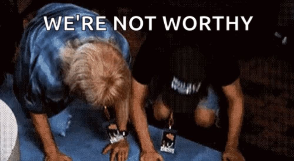 two men are doing push ups with the words " we 're not worthy " behind them