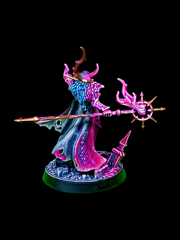 Horned chaos magic user burning hot pink magic fires from his staff and hand while screaming insults at foes and bystanders. 
He’s called Jeff and used to work in correspondence but doesn’t want people to know that. 