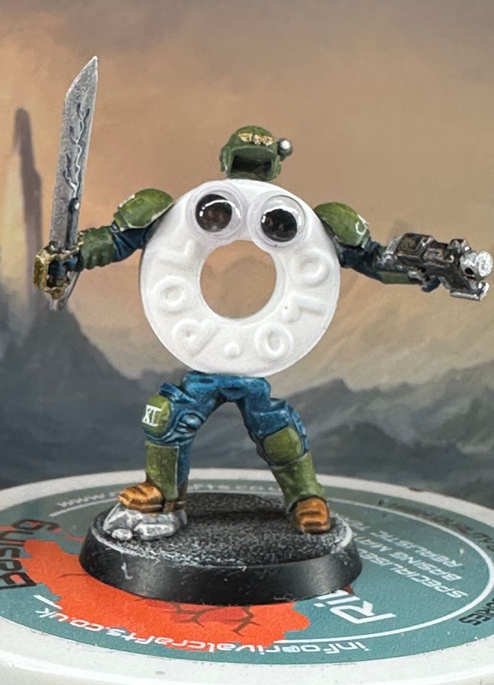 A polo mint with the arms and legs of a cadian shock trooper. It has a helmet and googly eyes