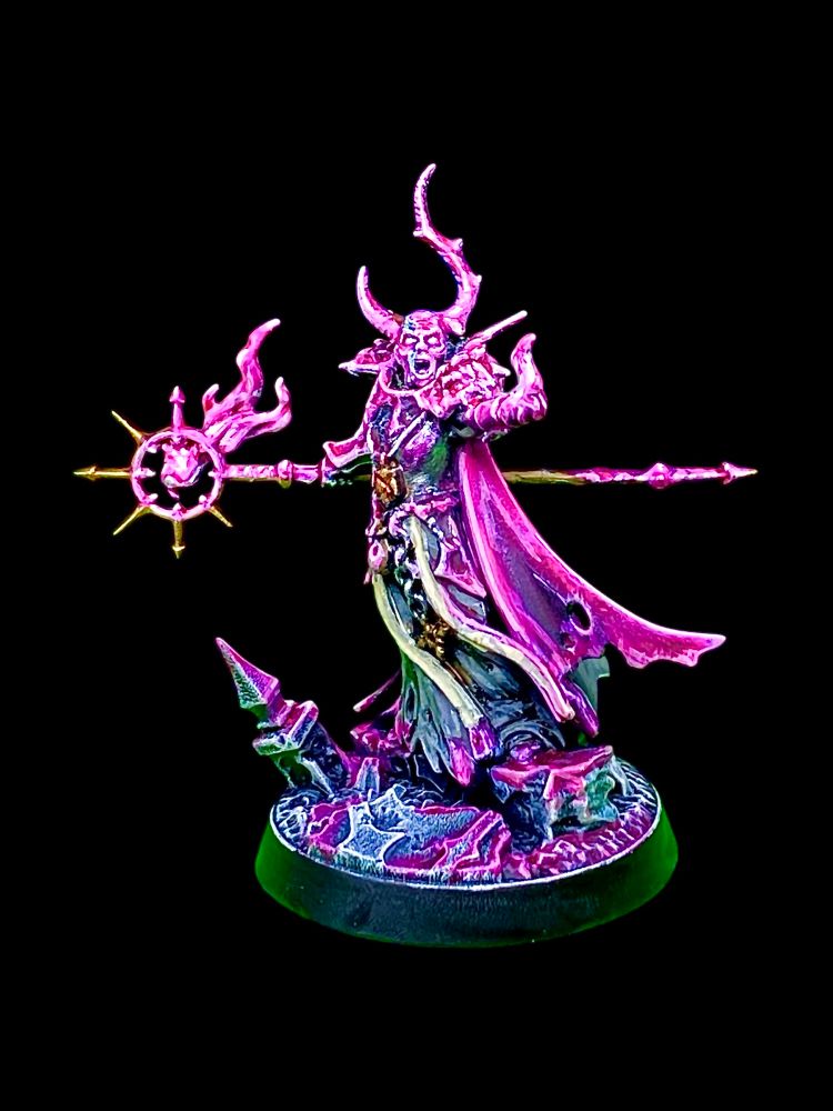 Horned chaos magic user burning hot pink magic fires from his staff and hand while screaming insults at foes and bystanders. 
He’s called Jeff and used to work in correspondence but doesn’t want people to know that. 