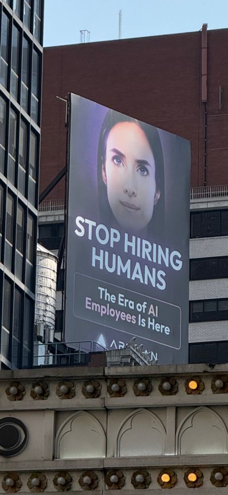 A stupid AI billboard in Times Square suggesting a stupid ass notion that now AI employees mean you dont need humans