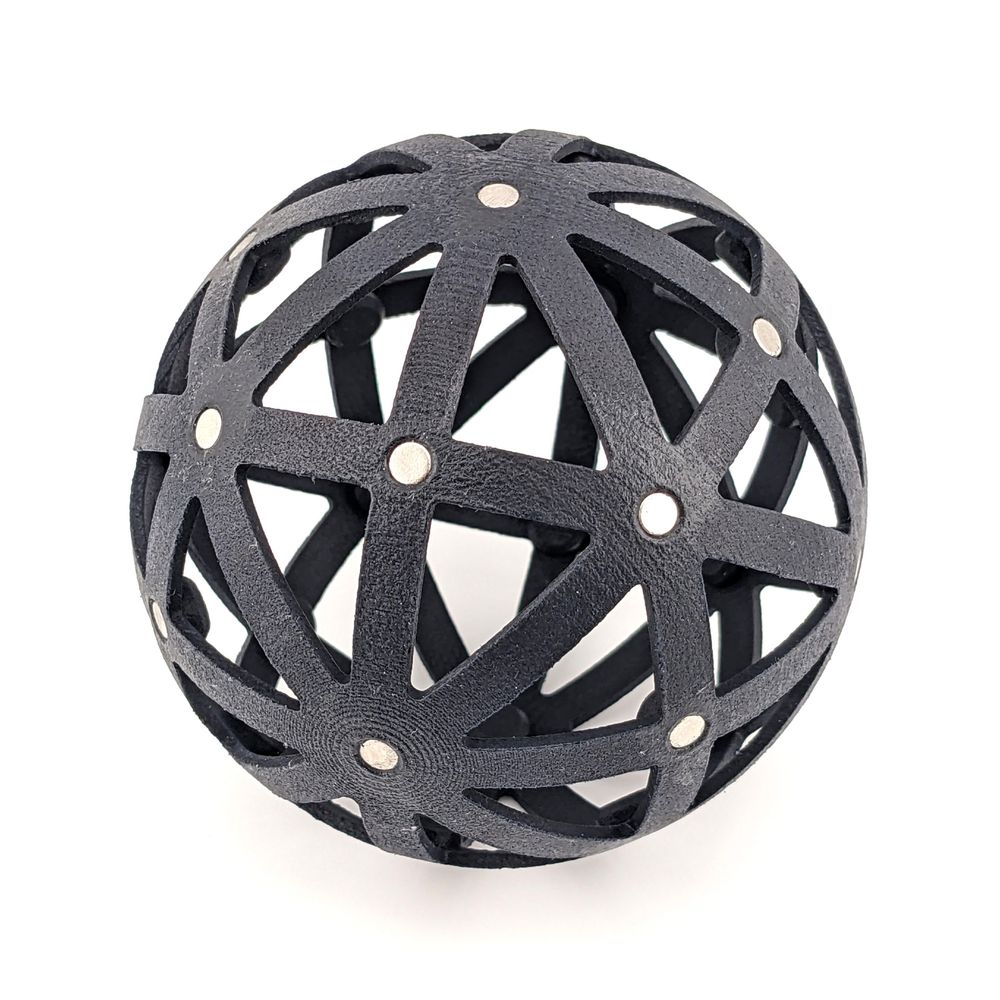 A spherical scaffold with magnets to stick tiles onto