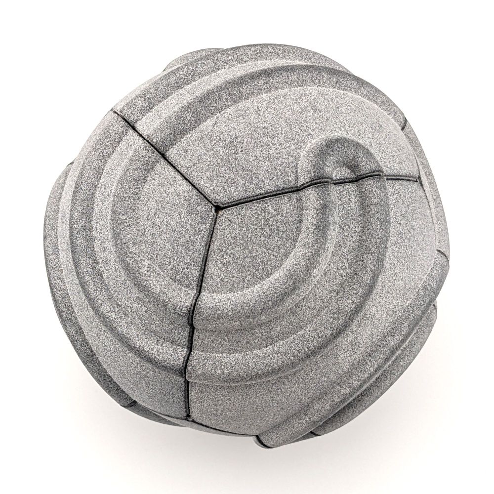 Cubic spherical Truchet tiling in the same speckled gray plastic