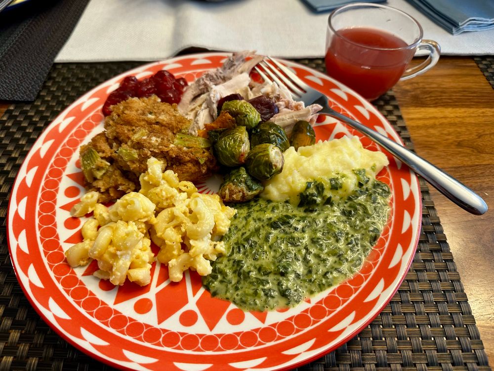 A plate full of Thanksgiving food 