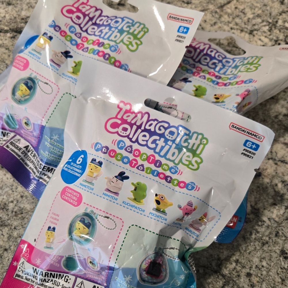 Picture of three "tamagotchi collectibles poop time" blind bags containing figures of shitting tamagotchi characters (this is a real thing that exists)