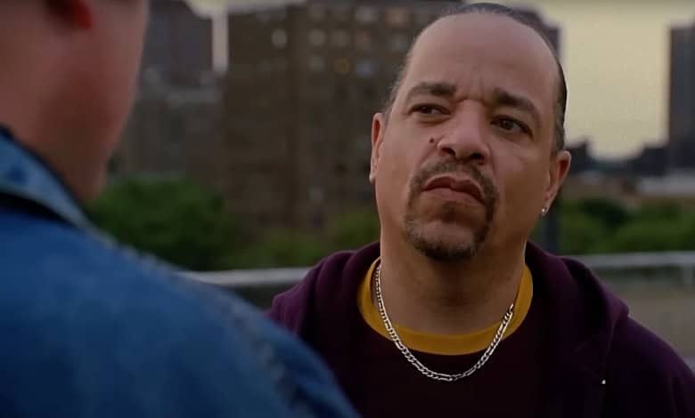 Ice-T glares at a man standing in front of him