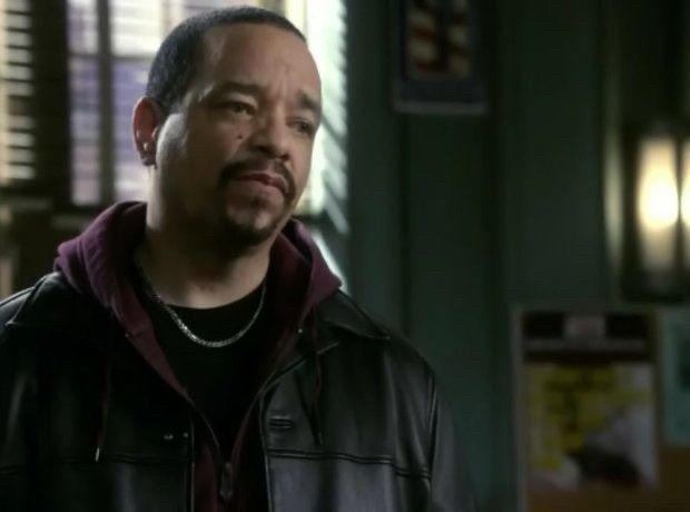 Ice-T looking at someone in the office with a concerned look on his face 