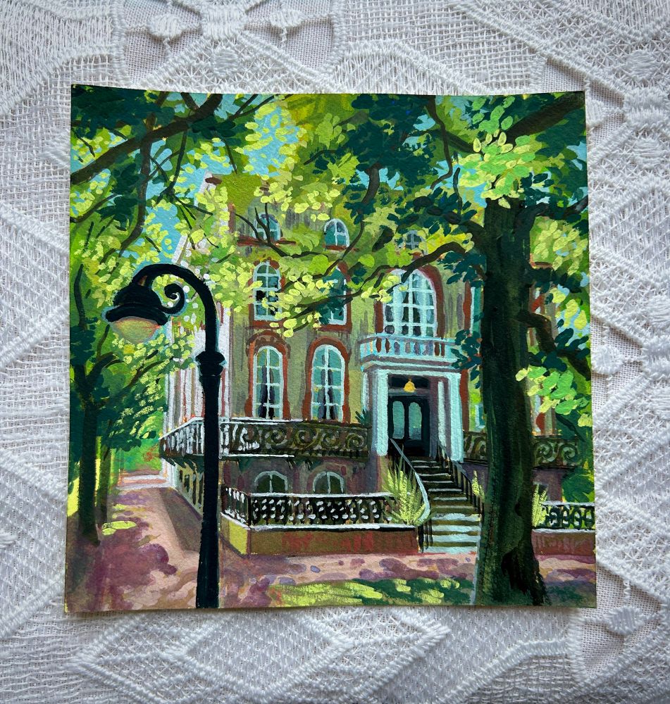 A gouache painting of a mansion in Savannah, Georgia. It’s surrounded by trees and a lamppost is in the foreground.