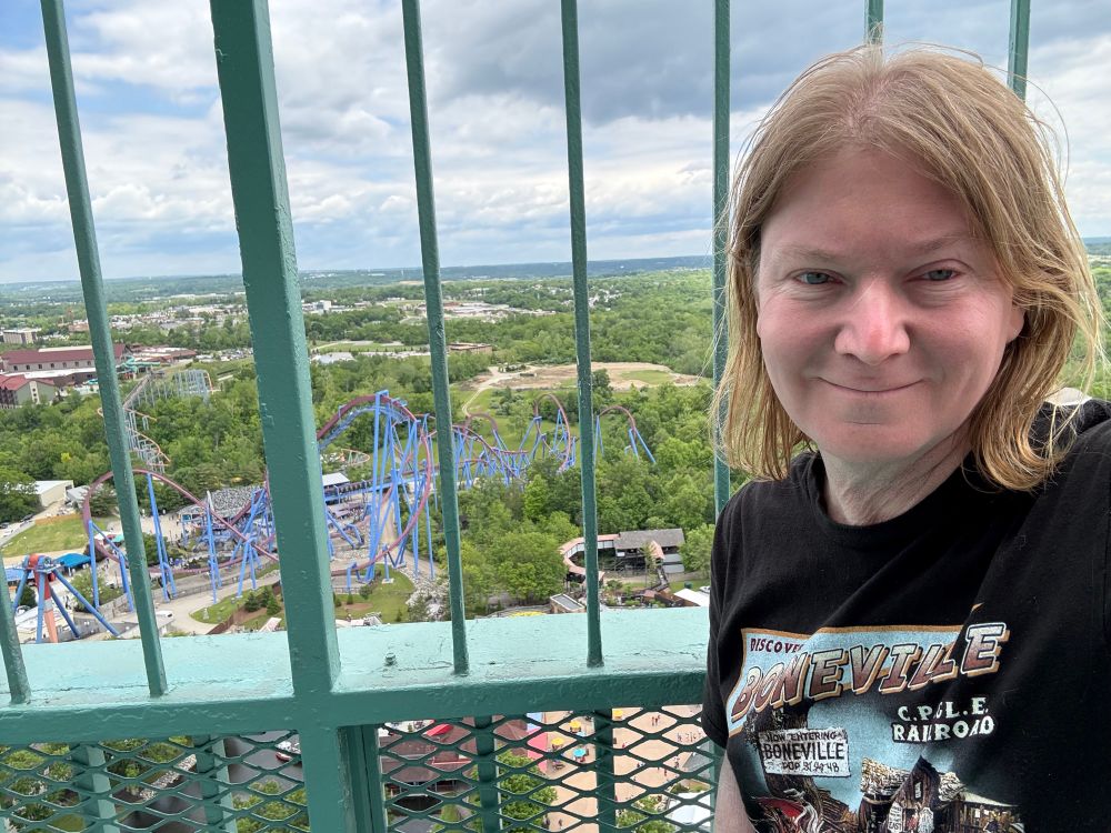 A selfie from the top of the Kings Island Eiffel Tower. Banshee is visible through the security bars.