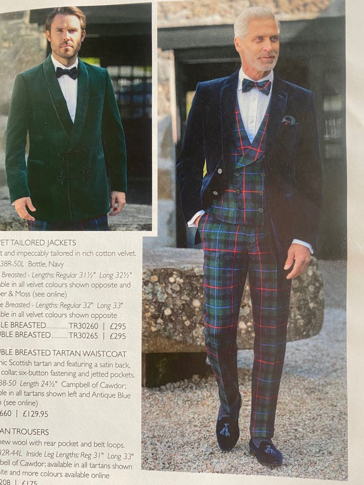 There's a lot going on. A page from the catalogue showing a model wearing tartan trews and waistcoat. The velvet slippers have tassels. He is weight a tartan bow tie, white shirt and velvet dinner jacket. 