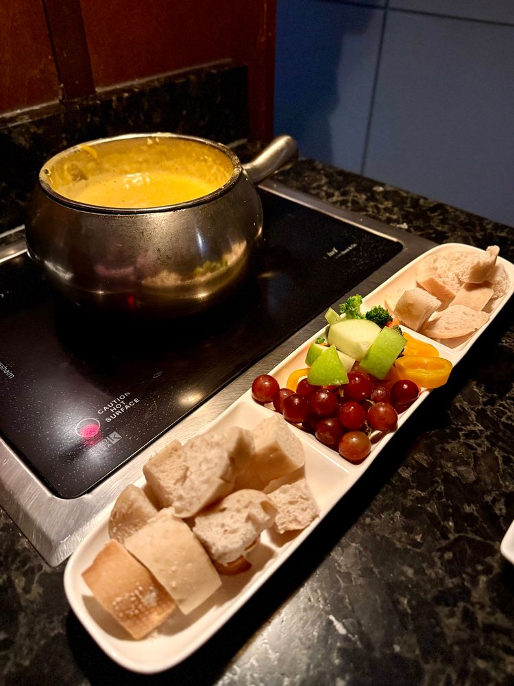 Wisconsin Cheddar fondue with various dippers.