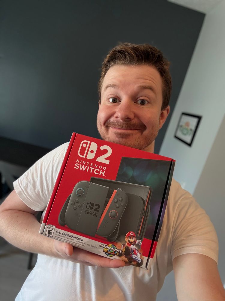 A photo of me holding my Nintendo Switch 2 box.