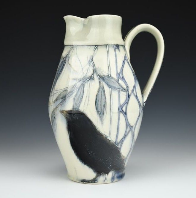 Pottery pitcher depicting a crow