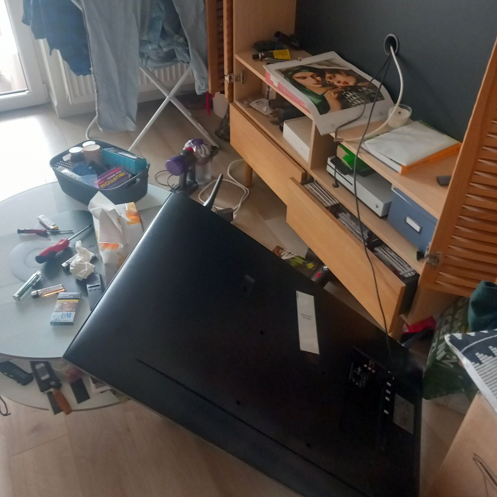 Tv thrown of a shelf.