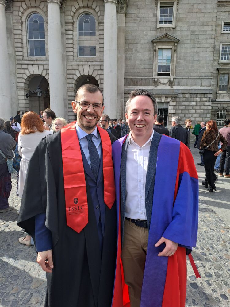 Photograph of Davide Romelli and Ronan Lyons in Trinity College, having been elected as Fellows.