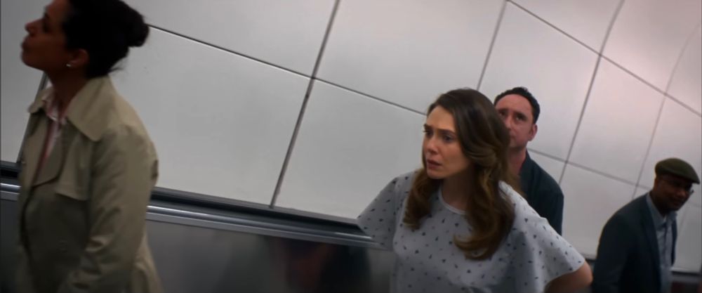 Elizabeth Olsen on an escalator