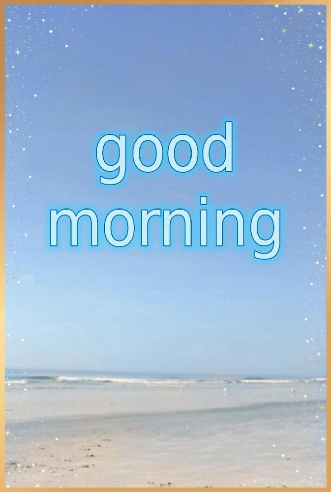 good morning
written in the blue sky. A small wave and some sand
