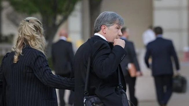 Torch Electronics owner Steven Miltenberger and his wife, Torch employee Sondra Miltenberger, leave the Thomas Eagleton federal courthouse in downtown St. Louis along with their legal team on Wednesday, Oct. 1, 2025. Michael Hamtil, Post-Dispatch