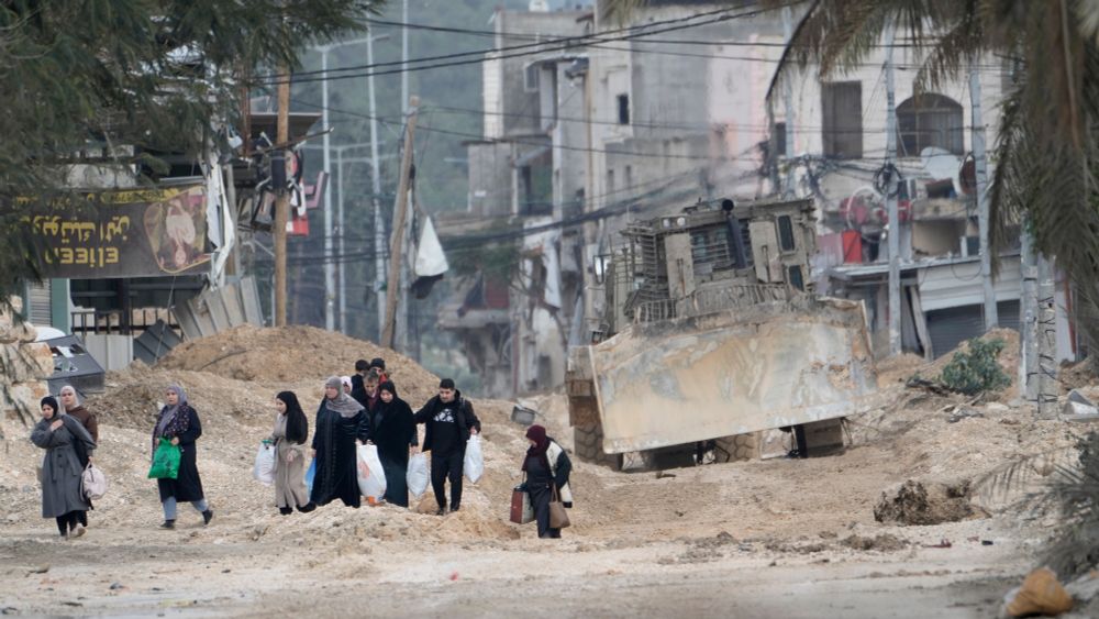 Residents of the West Bank refugee camp of Nur Shams, near Tulkarem, evacuate their homes as the Israeli military continues its operation in the area on Feb. 11, 2025. (AP Photo/Majdi Mohammed, File)