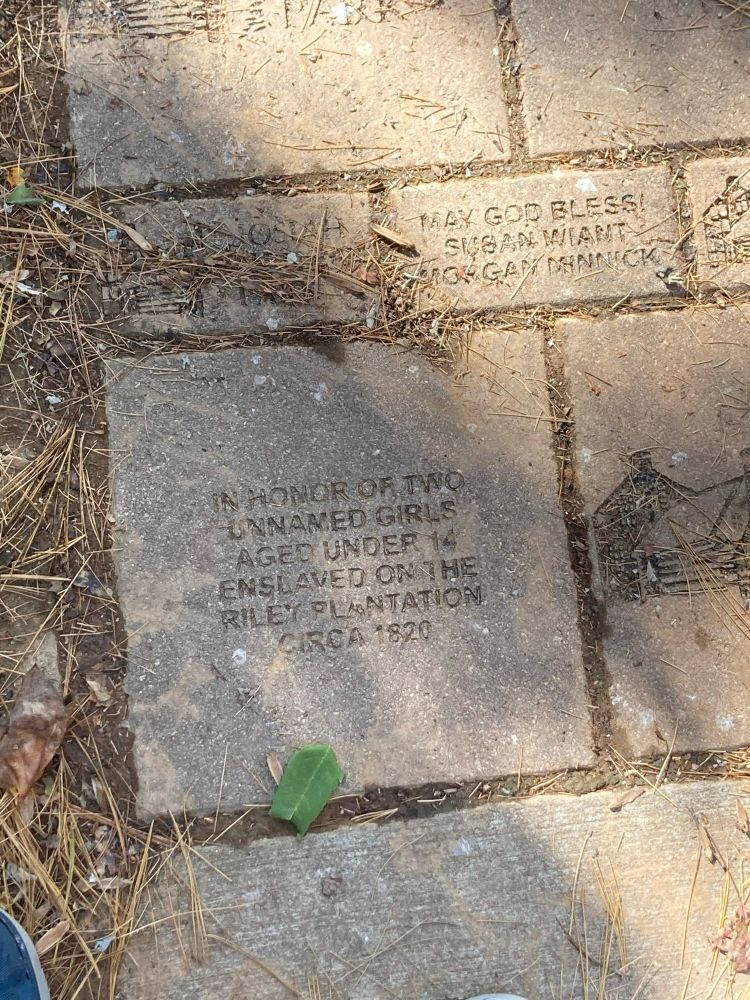 A plaque dedicated to “two unnamed girls aged 14 enslaved on the riley plantation”