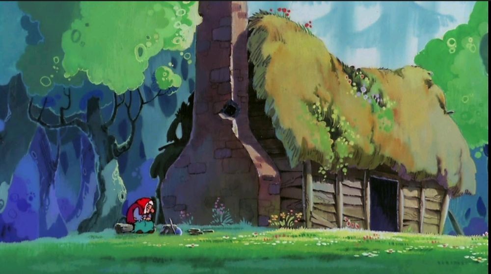 A thatched cottage in a woodland meadow. An old woman with a tattered cardigan and red head scarf is sitting on a log beside it. It's sunny and little flowers are growing on the ground and the thatched roof.