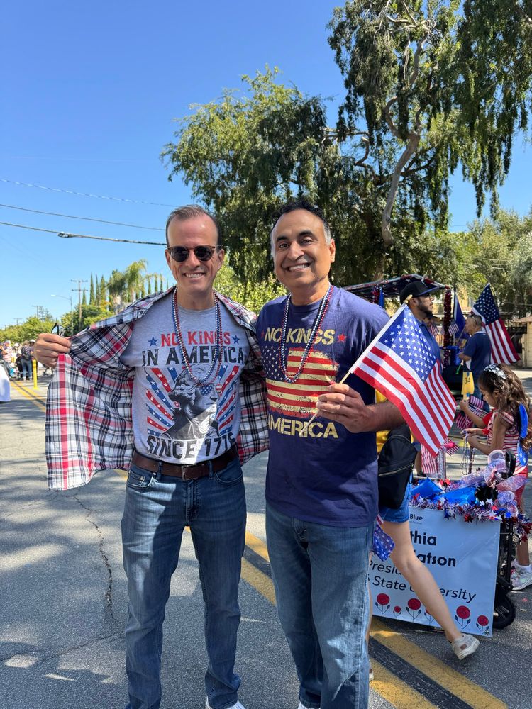 Marc Berman and Ash Kalra in No Kings t-shirts. 