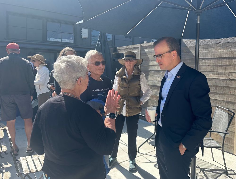 Assemblymember Berman speaks with a small group of constituents. 