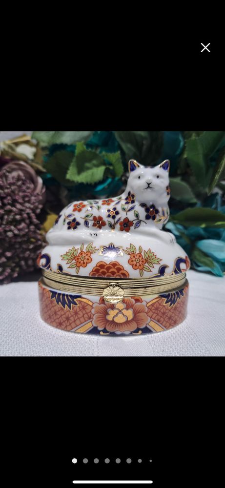 Porcelain keepsake box in the shape of a cat with hand painted Japanese floral motifs