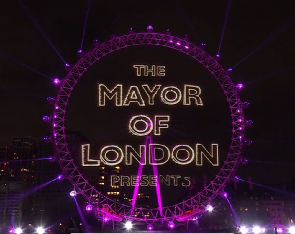 The London Eye with graphics superimposed on it to make it look like a projection 