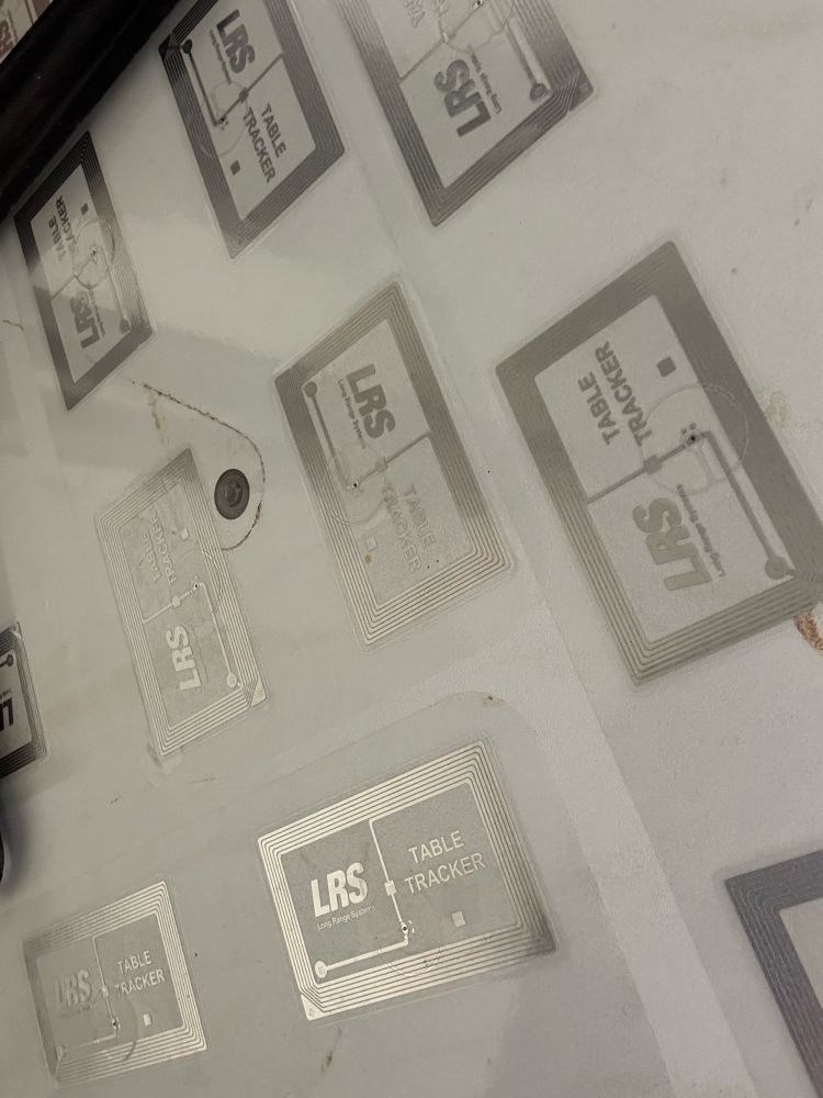 NFC tags stuck to the underside of a table