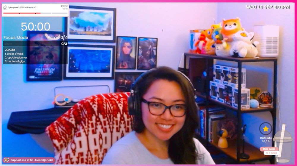 Fanart in the background, other nerdy decor to the right and JCru in the center