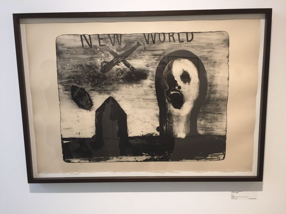 An artwork of a giant face to the right, a small house to the left and a crude plane-shape in the sky. At the top, it says “NEW WORLD”