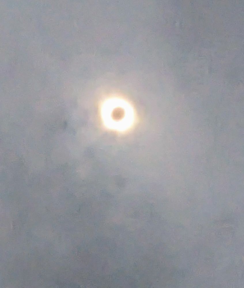 Total eclipse viewed through thin cloud cover