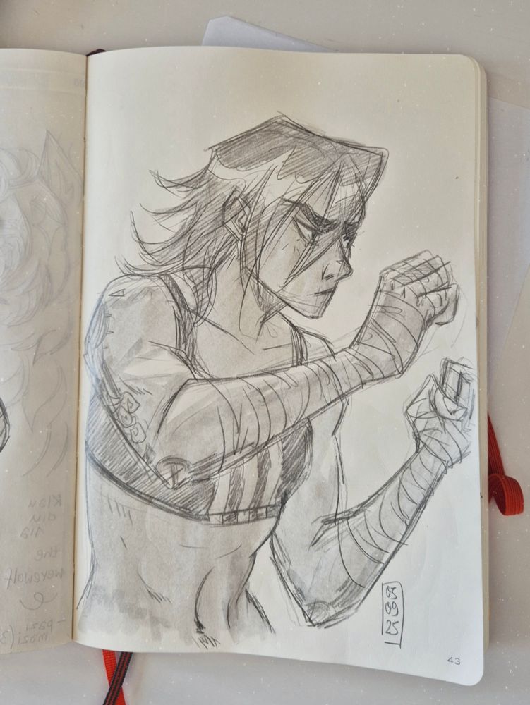 Photo of a sketchbook page showing a pencil and marker sketch of Vi waist up, with her fists up, wearing a sports bra and shorts. She's practicing her boxing moves.