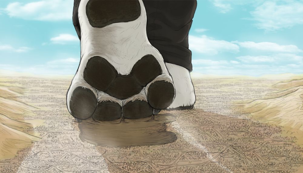 Rear view of a pair of extremely large dog paws walking across a much smaller, dusty looking city and arid landscape. Leaving behind deep paw prints, one paw is lifting up with dust falling from it while the other is in front, flat on the ground mostly hidden from view. They are wearing long black pants.