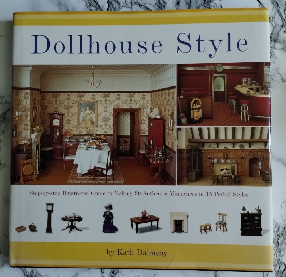 A picture of a book cover that teaches how to make dollhouse miniatures. The following photos are pages from the book. 