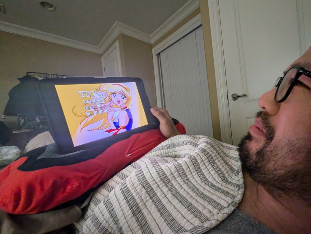 asian man in glasses and beard being tortured