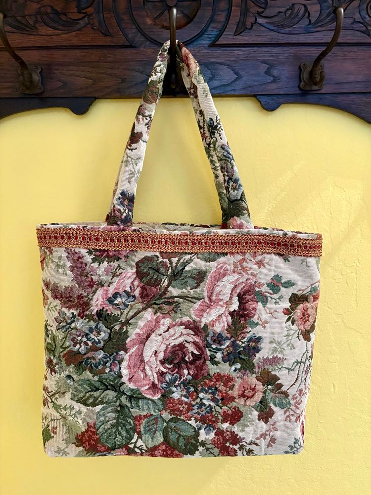 I made this bag for a friend. Italian tapestry exterior fabric w/ cotton brocade interior fabric. This bag has one interior pocket and a long key lanyard. I think this is the prettiest bag of all. 
