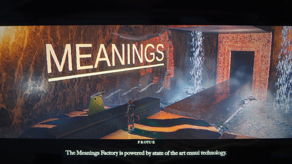 A frog at a desk informs the skateboarder that the Meanings Factory is powered by state of the art ennui technology in the lobby of the Meanings Factory