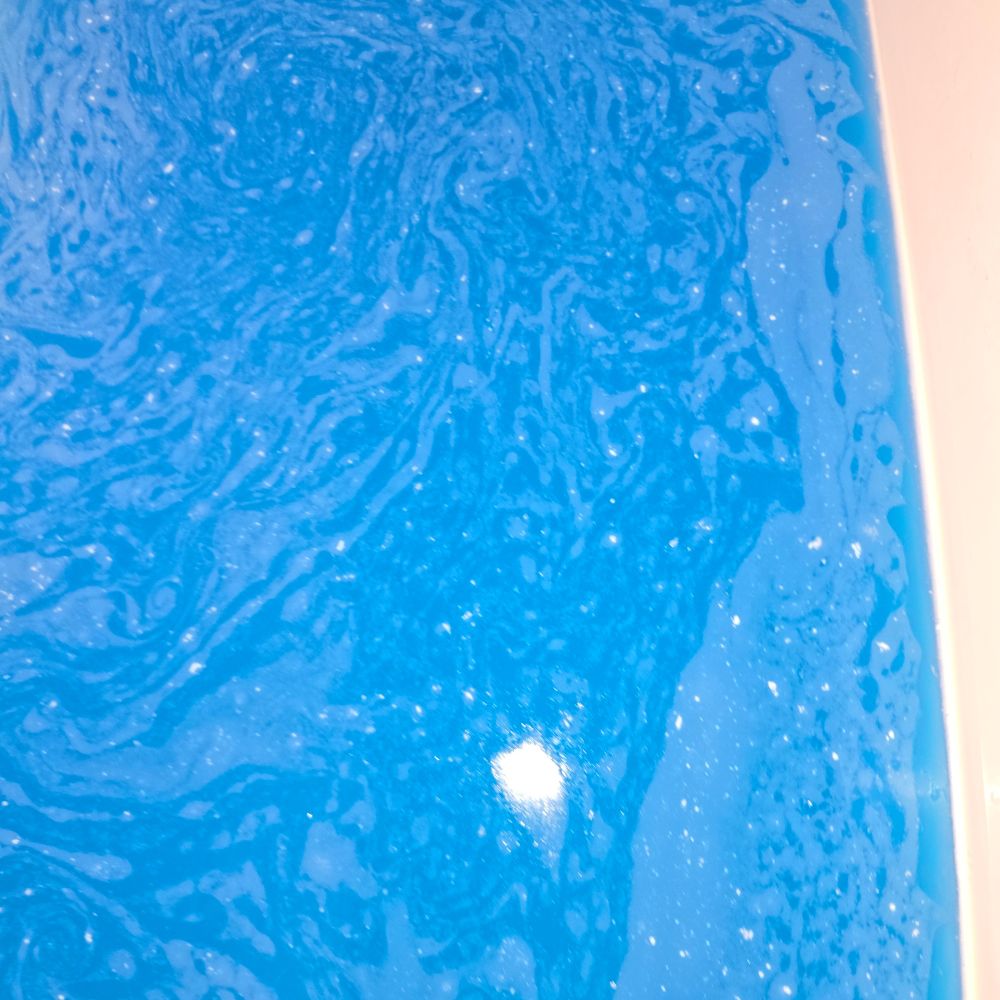 Blue bathwater from the blueberry scented 25mg Bathbomb I ordered from @Jumpyjellybean.bsky.social