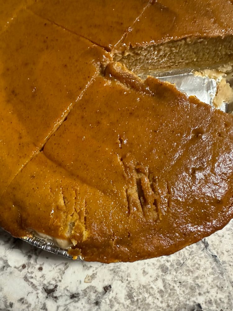 Close up of marked pie; they appear to be tiny bite marks, maybe (probably) from a tiny cat.