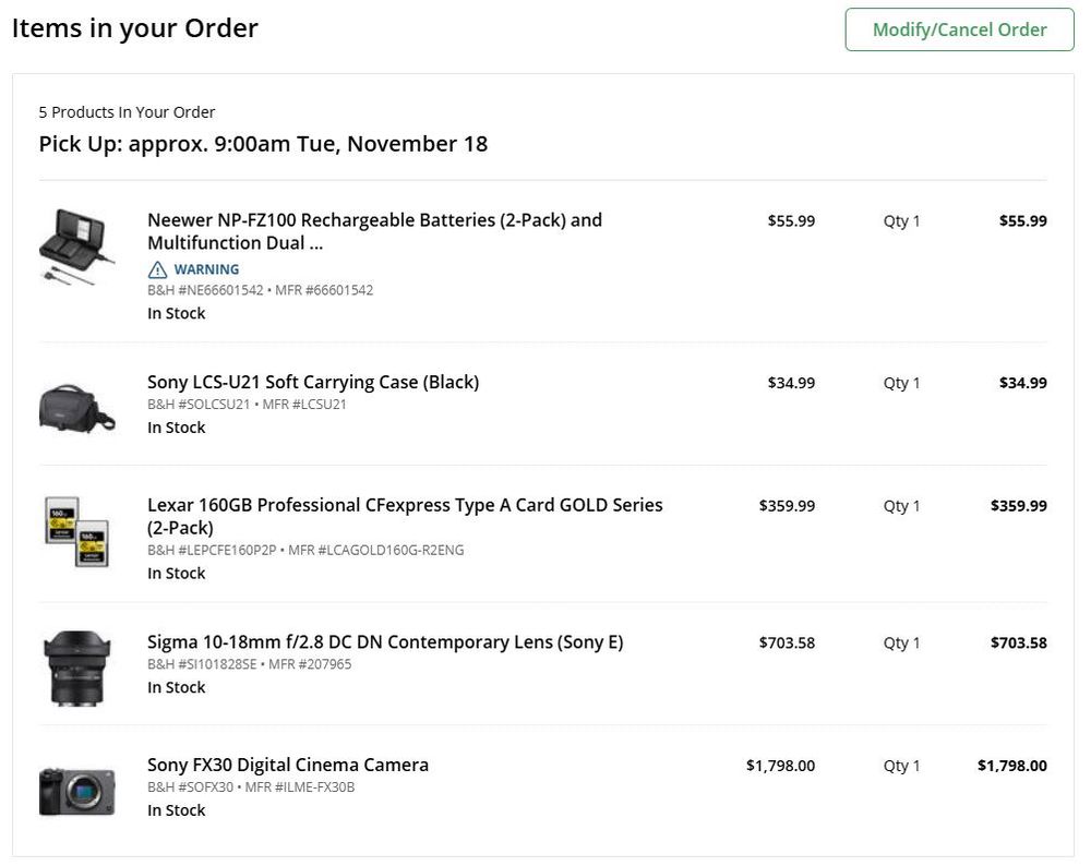 screenshot showing order placed for sony fx30 digital camera, sigma lens, cfexpress memory cards, carrying case, and spare batteries.